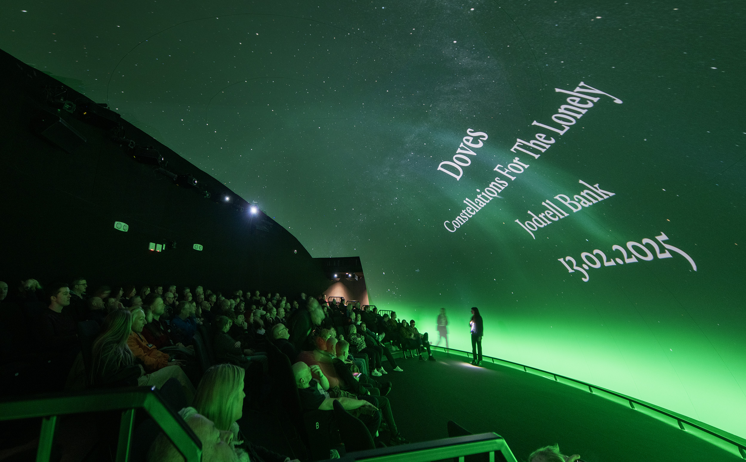 A photo of an audience attending a Dome Show screening of the Doves new album, 'Constellations for the Lonely.'